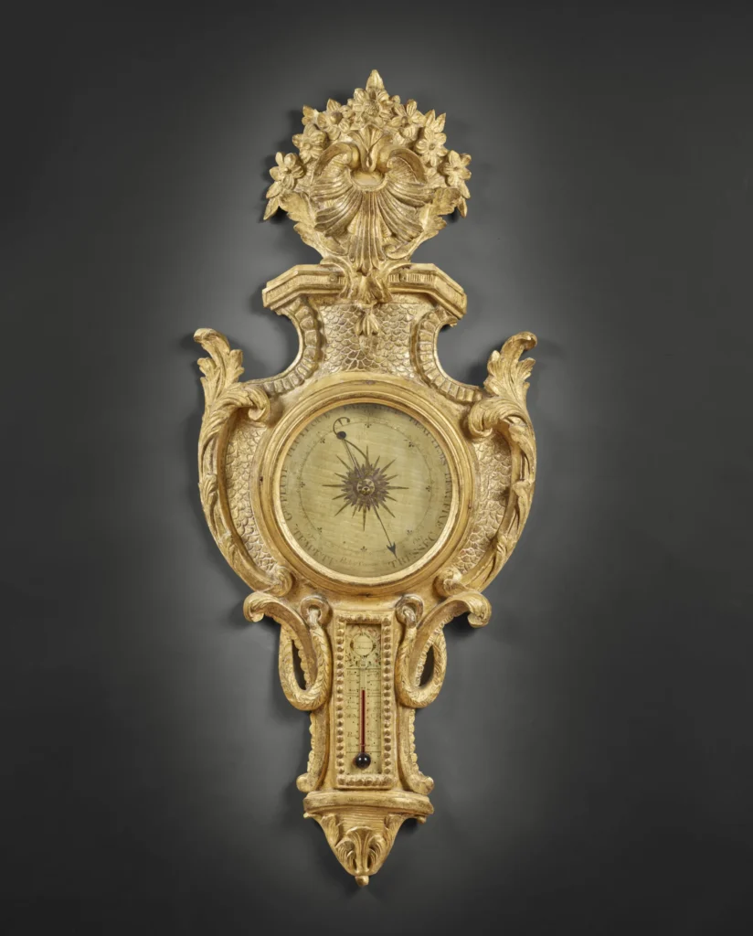 Carved barometer-thermometer with fish scales motif