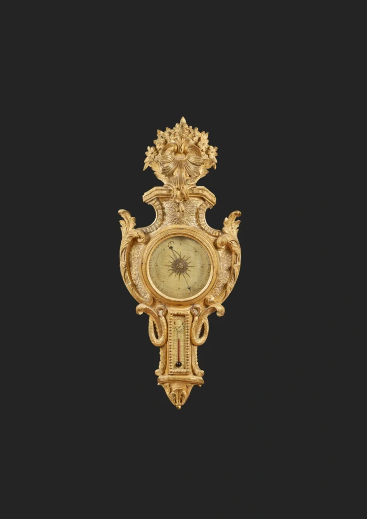 Carved barometer-thermometer with fish scales motif
