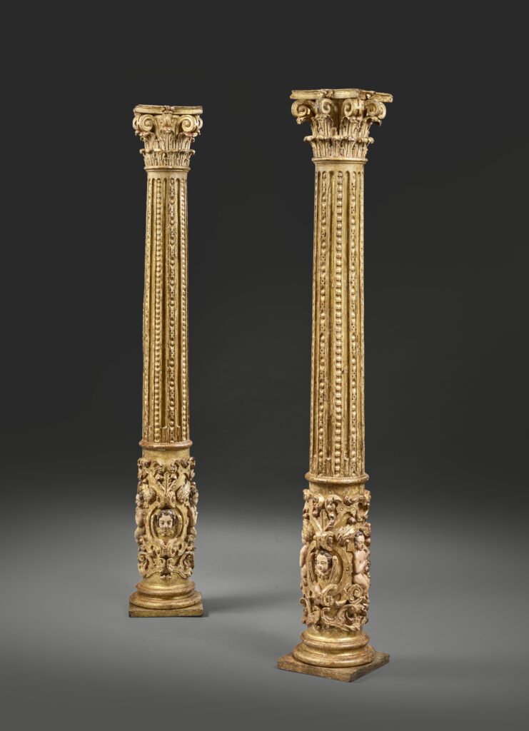 Pair of columns decorated with angels’heads and Putti